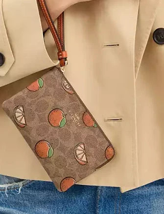 Coach Corner Zip Wristlet In Signature Canvas With Orange Print - Image 2